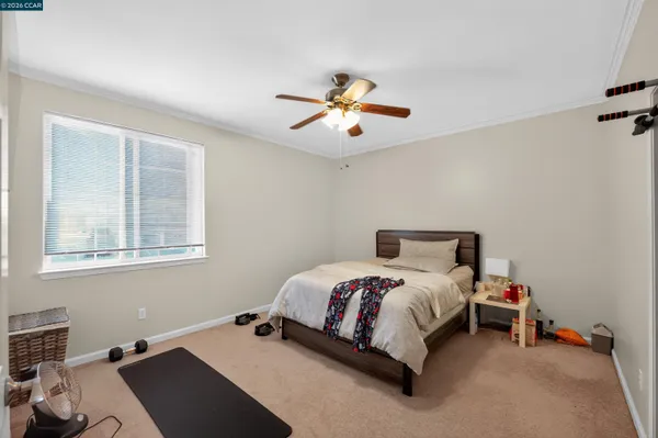 a bed room with a bed and a chandelier