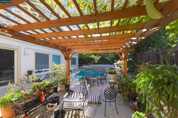 a view of yard with patio