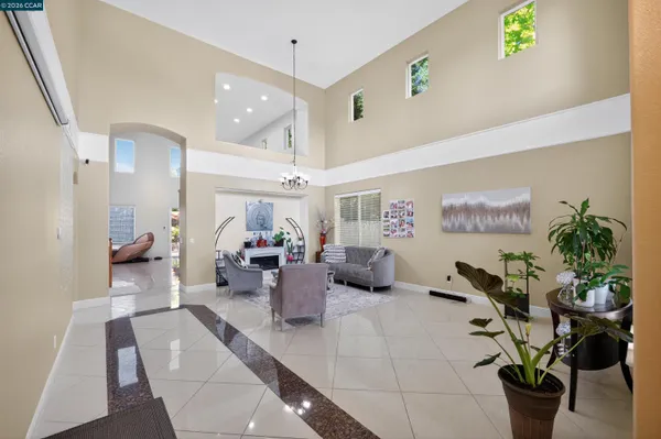 a living room with furniture and couches