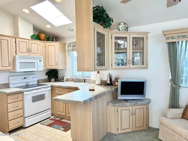 a kitchen with a stove a sink and a refrigerator