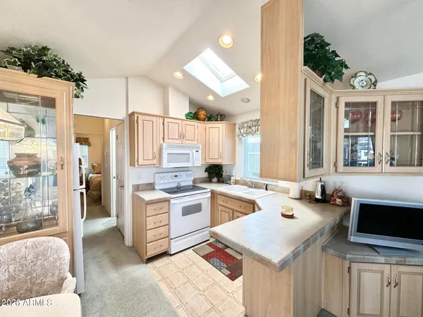 a kitchen that has a lot of cabinets in it