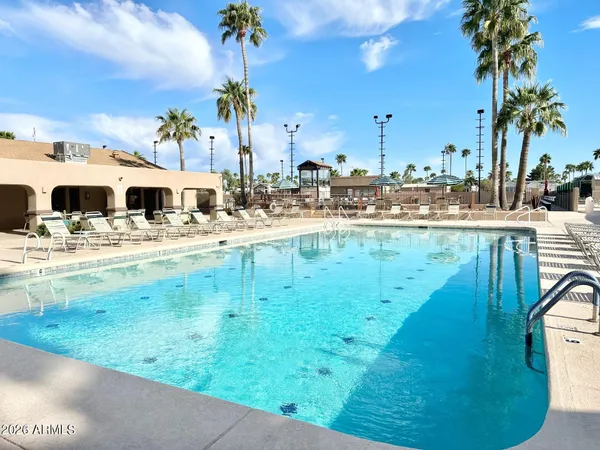 a view of swimming pool with outdoor seating