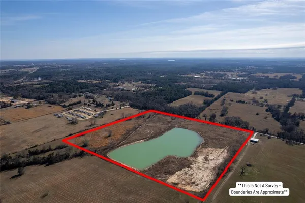 a view of a lake with a yard