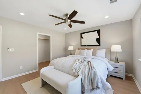 a bedroom with a large bed and a window