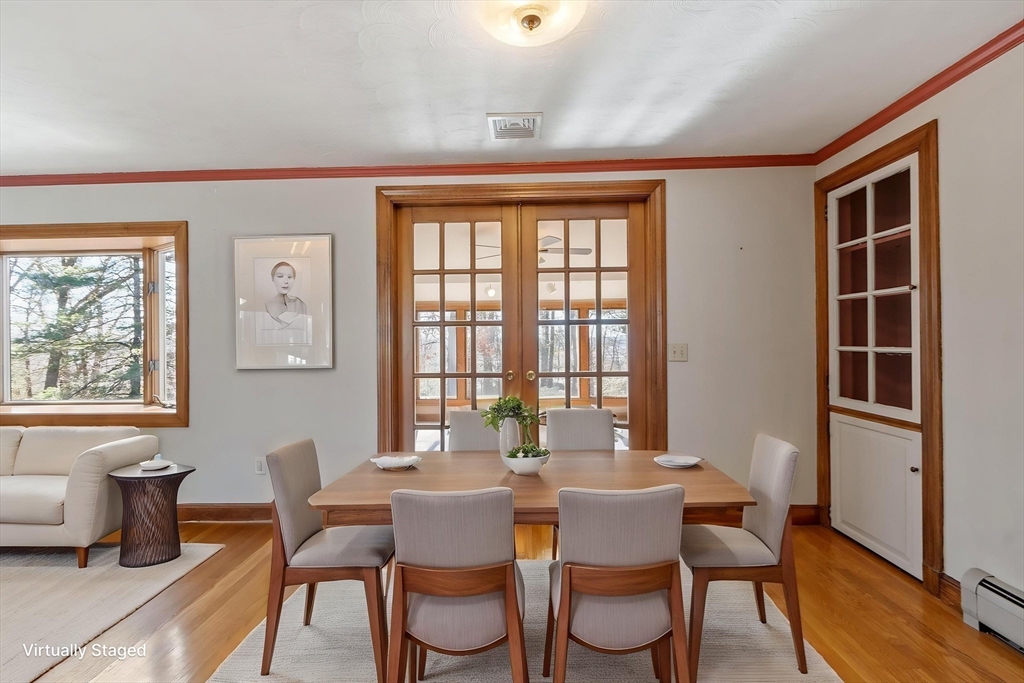 26 Lothrop Road Reading, MA 01867 - Photo 14 of 41 a view of a dining room with furniture and windows