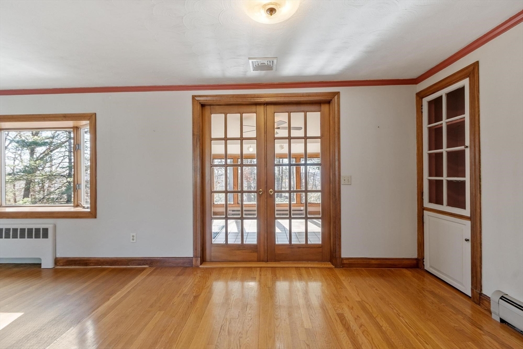 26 Lothrop Road Reading, MA 01867 - Photo 15 of 41 an empty room with wooden floor and windows
