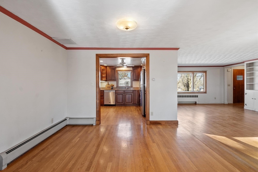 26 Lothrop Road Reading, MA 01867 - Photo 16 of 41 wooden floor in an empty room with a window