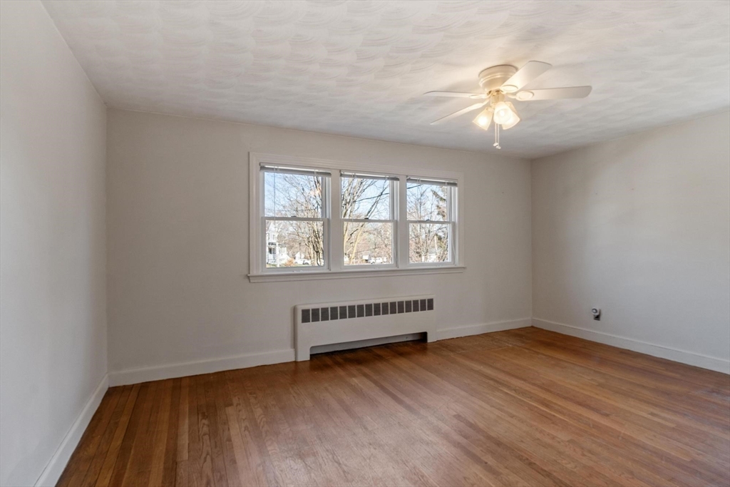 26 Lothrop Road Reading, MA 01867 - Photo 23 of 41 wooden floor in an empty room with a window