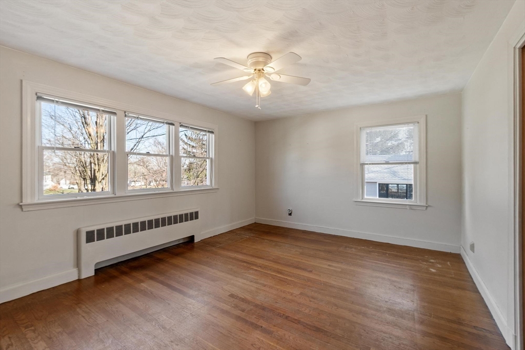 26 Lothrop Road Reading, MA 01867 - Photo 24 of 41 a view of an empty room with a window