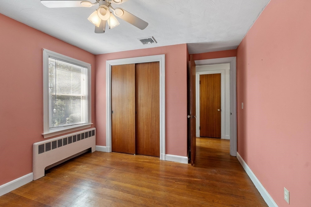 26 Lothrop Road Reading, MA 01867 - Photo 25 of 41 an empty room with wooden floor and windows
