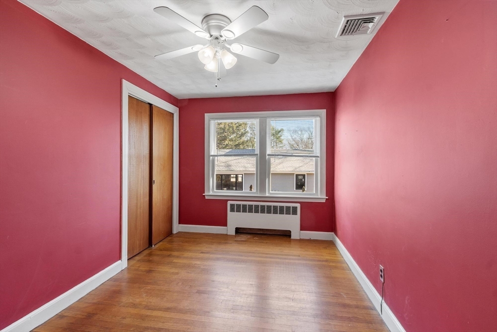 26 Lothrop Road Reading, MA 01867 - Photo 26 of 41 wooden floor in an empty room with a window