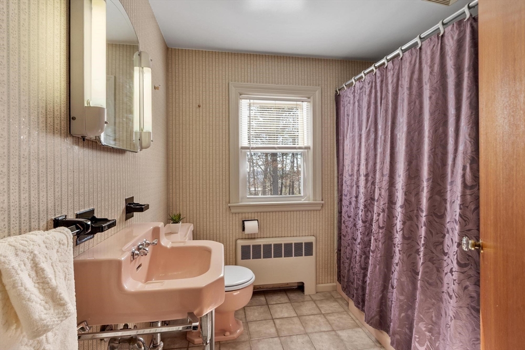 26 Lothrop Road Reading, MA 01867 - Photo 27 of 41 a bathroom with a sink toilet and shower