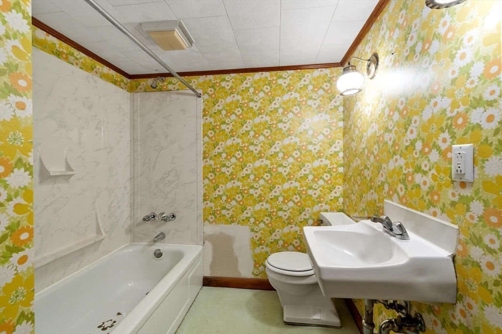 26 Lothrop Road Reading, MA 01867 - Photo 28 of 41 a bathroom with a sink and a mirror