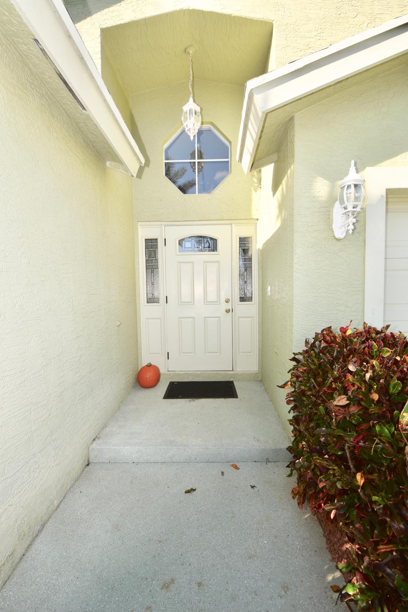 2469 Southwest Regency Road Stuart, FL 34997 - Photo 3 of 75 EXTERIOR FRONT WALKWAY