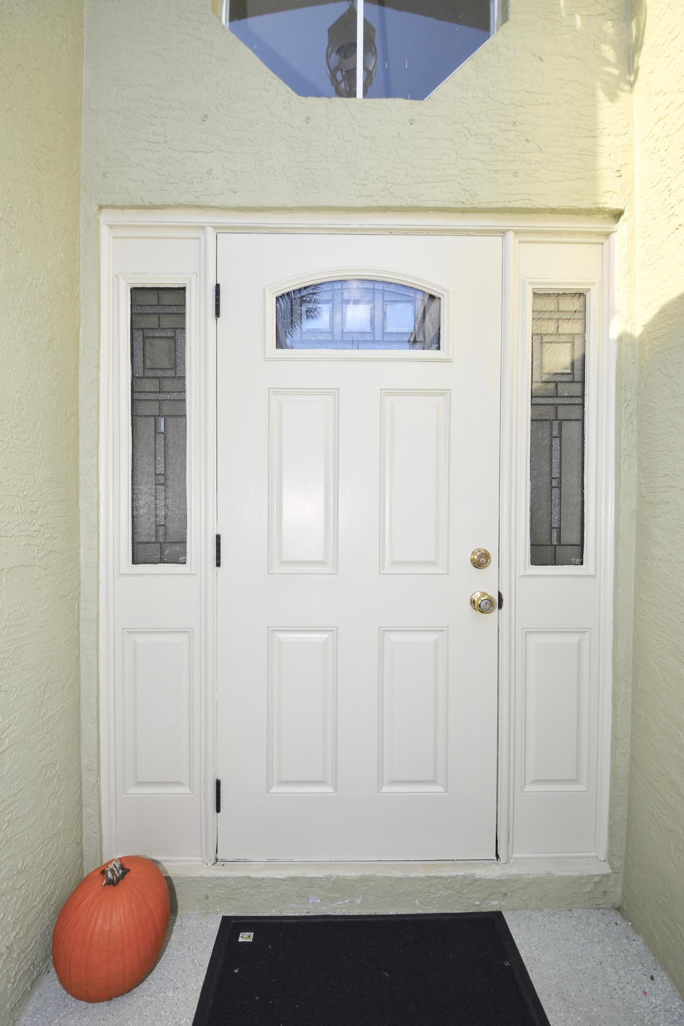 2469 Southwest Regency Road Stuart, FL 34997 - Photo 4 of 75 EXTERIOR FRONT DOOR