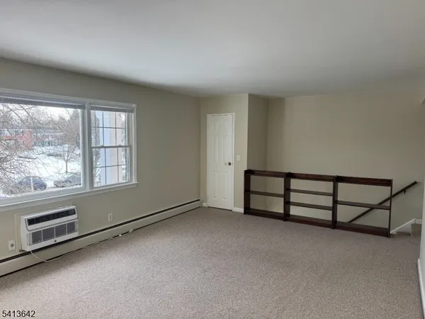 a kitchen with a refrigerator and a sink