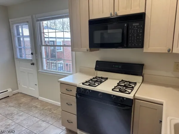 an empty room with large windows