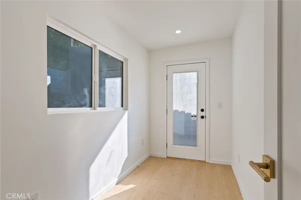 a view of a hallway with a window