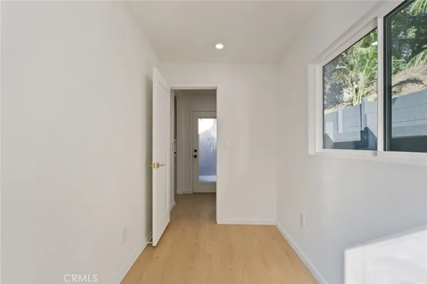 a view of a house with a door and wooden walls