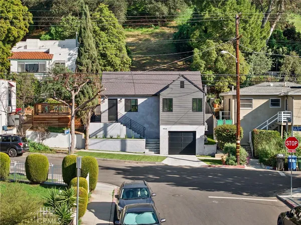 an aerial view of houses with outdoor space