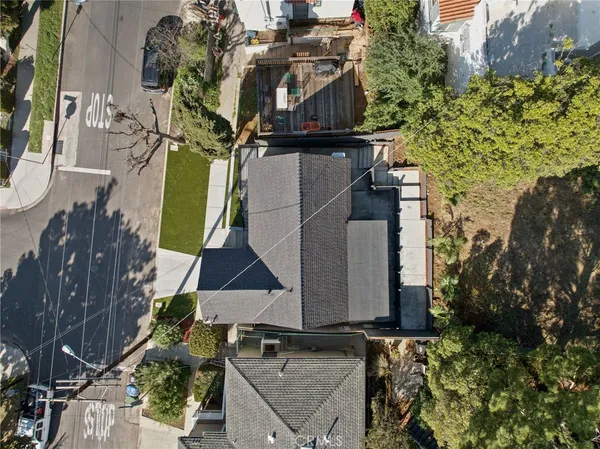an aerial view of residential houses with outdoor space