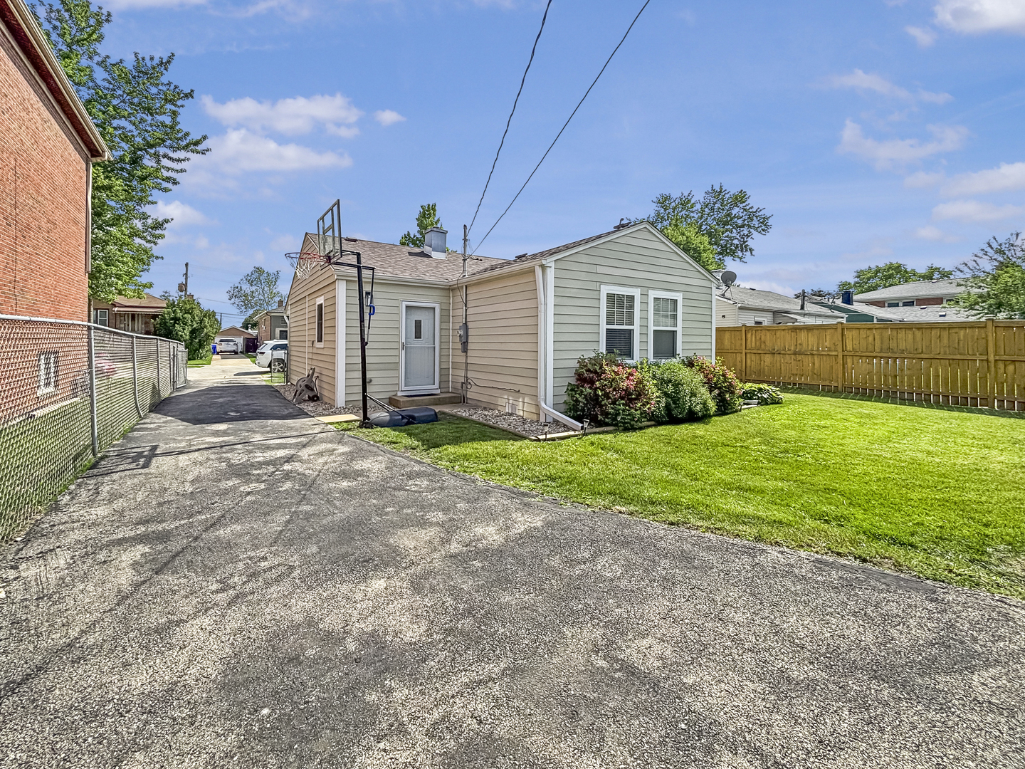8538 45th Street Lyons, IL 60534 - Photo 25 of 29 a front view of a house with garden