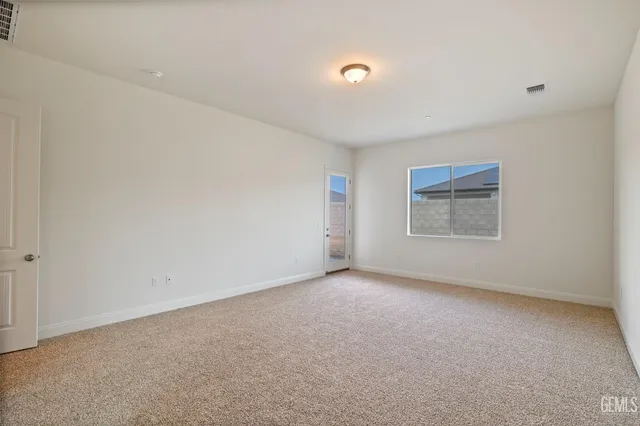 an empty room with a empty space and window