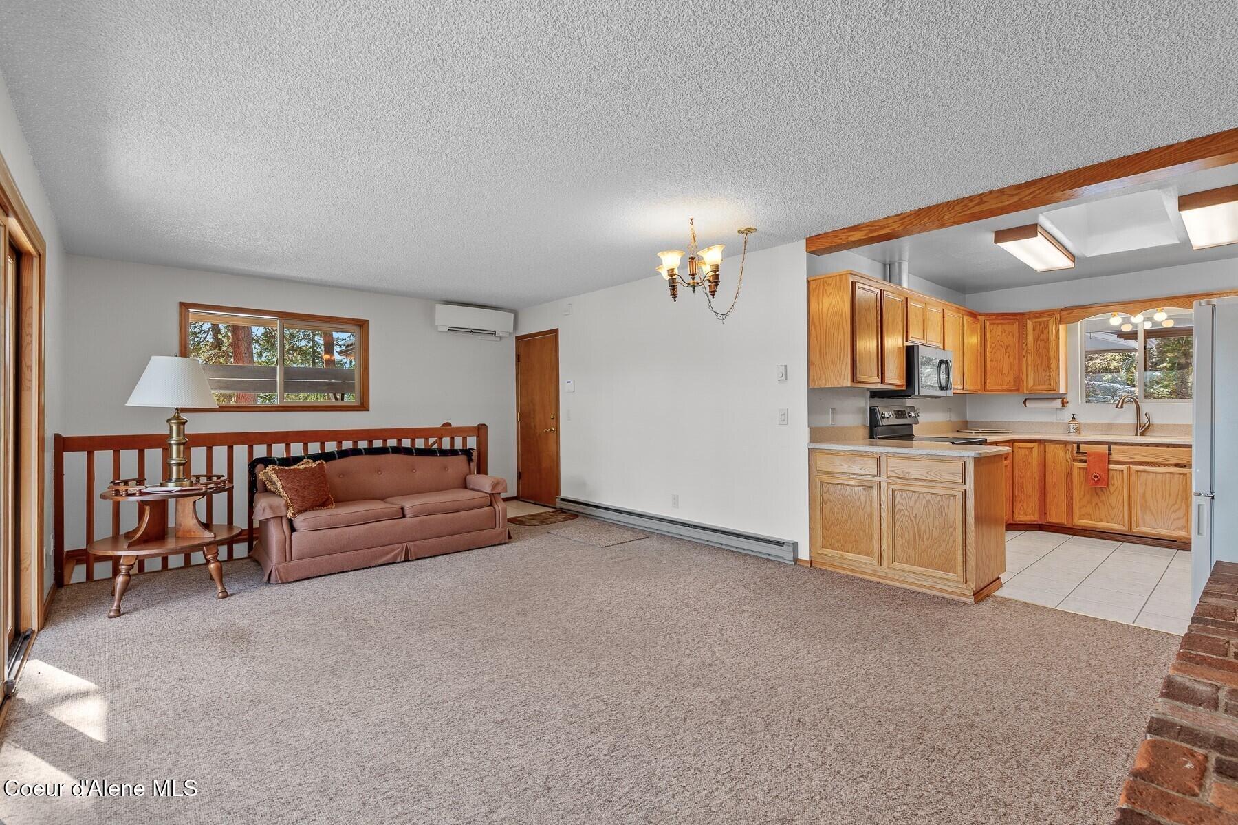5977 East McMahon Road Hayden, ID 83835 - Photo 8 of 39 Family Room & Kitchen Flow