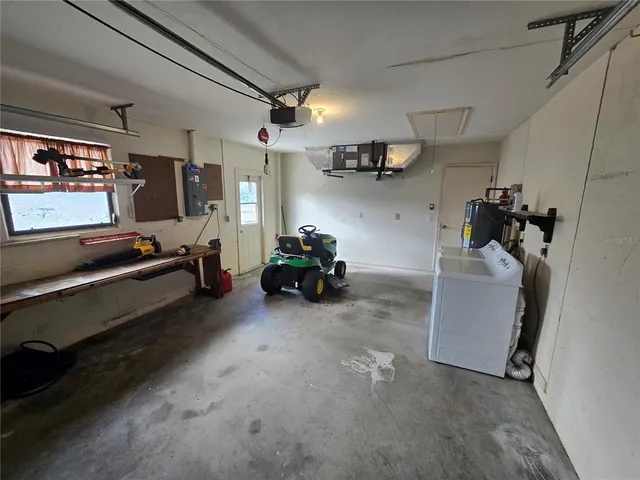 a view of a storage & utility room with two washing machine
