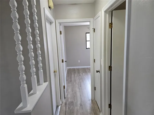 a view of a wooden door with a glass door