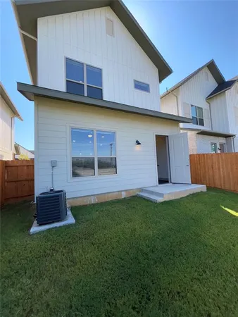 a front view of house with yard and outdoor seating