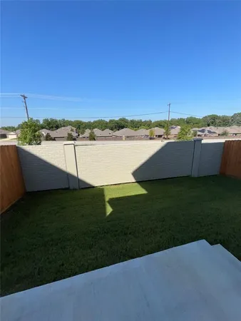 a view of a lake with a yard