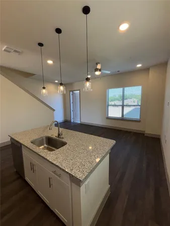 a kitchen with sink and window