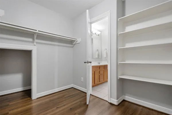 a view of an empty walk in closet