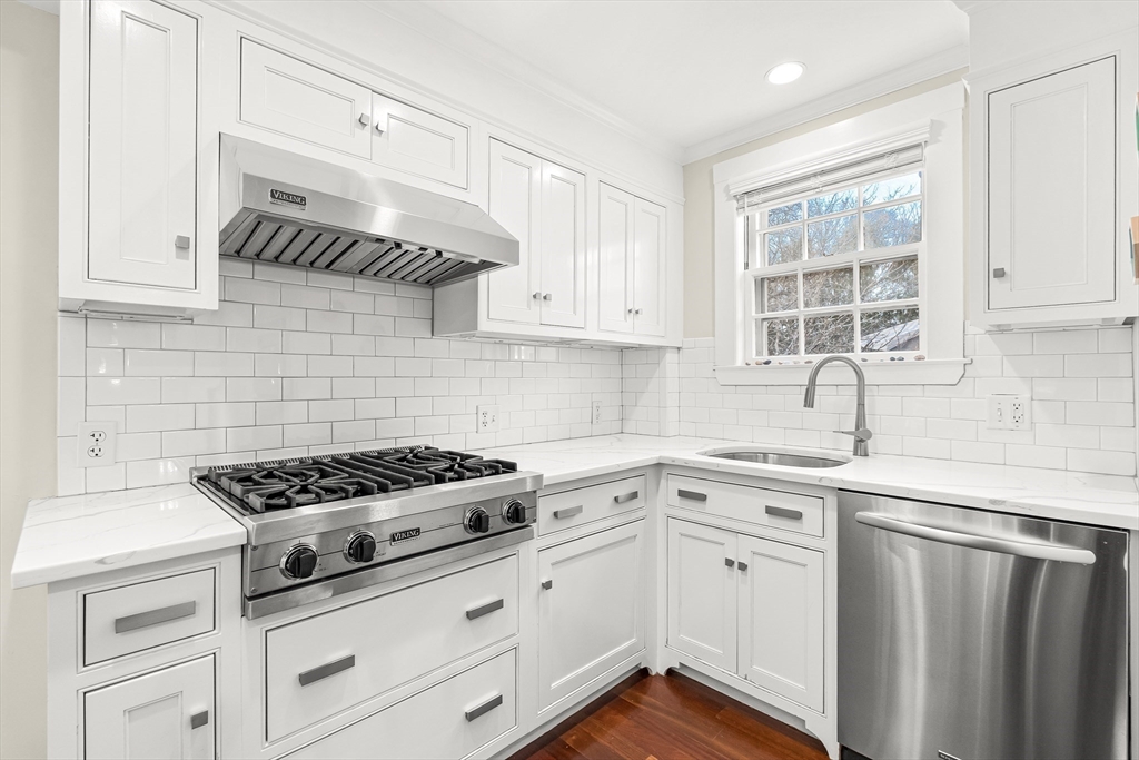 89 Lovell Road Melrose, MA 02176 - Photo 14 of 38 a kitchen with cabinets appliances a sink and a window