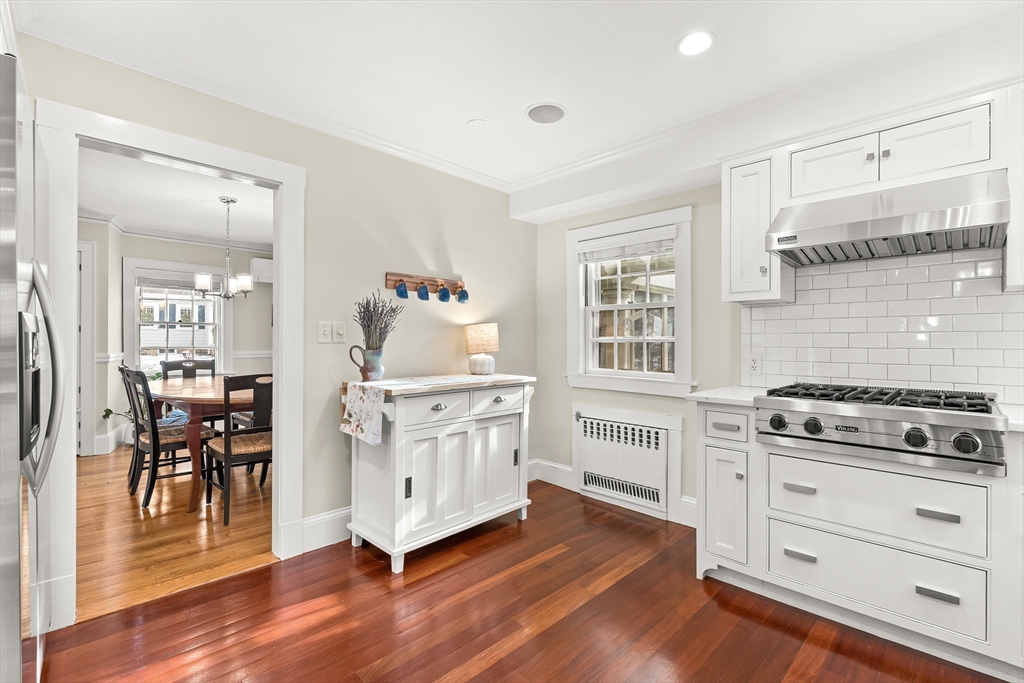 89 Lovell Road Melrose, MA 02176 - Photo 16 of 38 a kitchen with white cabinets and white appliances