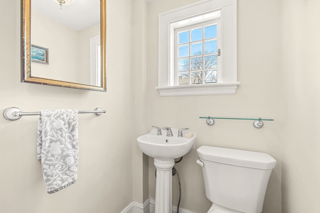 89 Lovell Road Melrose, MA 02176 - Photo 19 of 38 a bathroom with a sink toilet and mirror