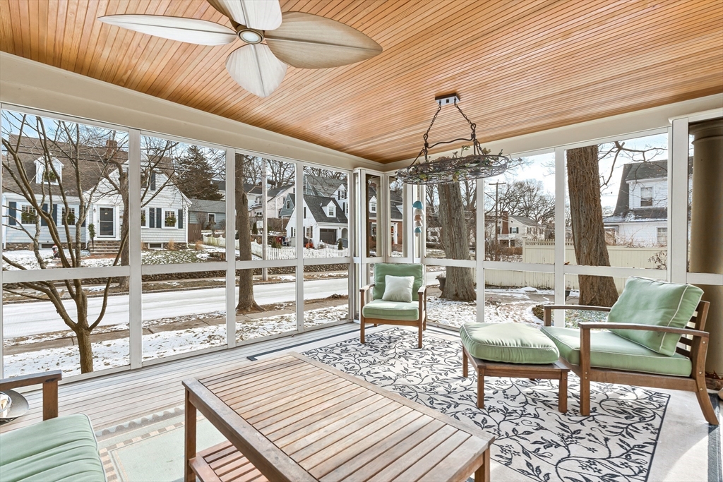 89 Lovell Road Melrose, MA 02176 - Photo 20 of 38 a living room with lots of furniture and a chandelier