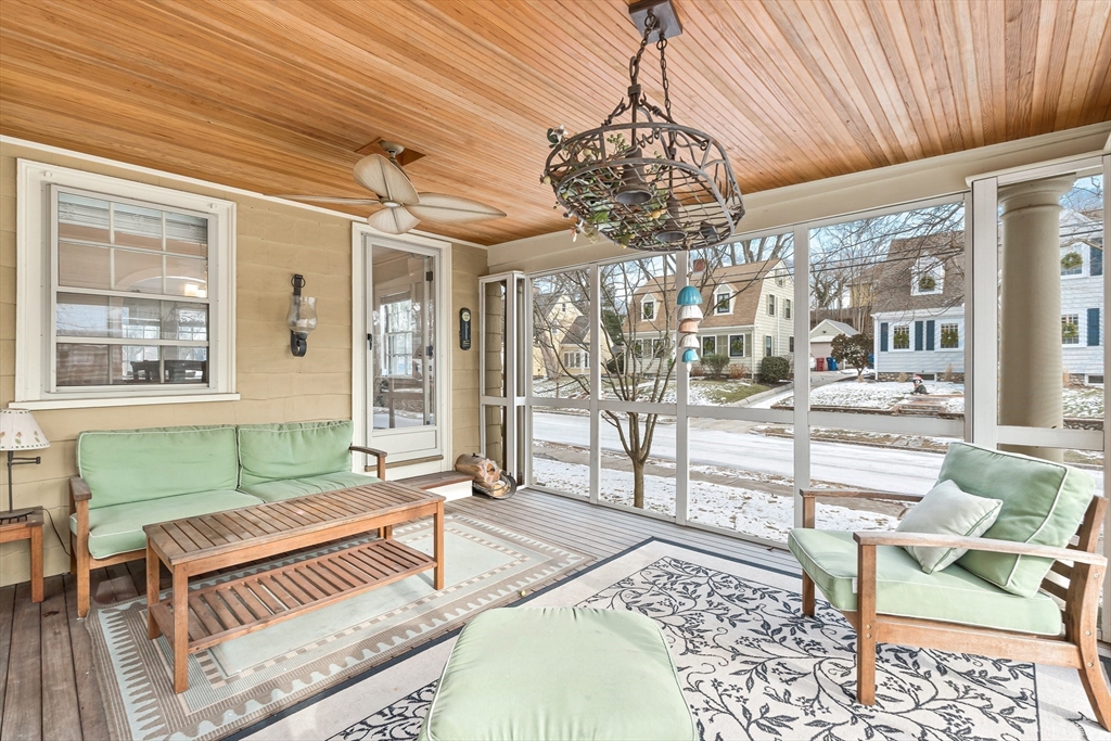 89 Lovell Road Melrose, MA 02176 - Photo 22 of 38 a spacious bedroom with a bed and a chandelier