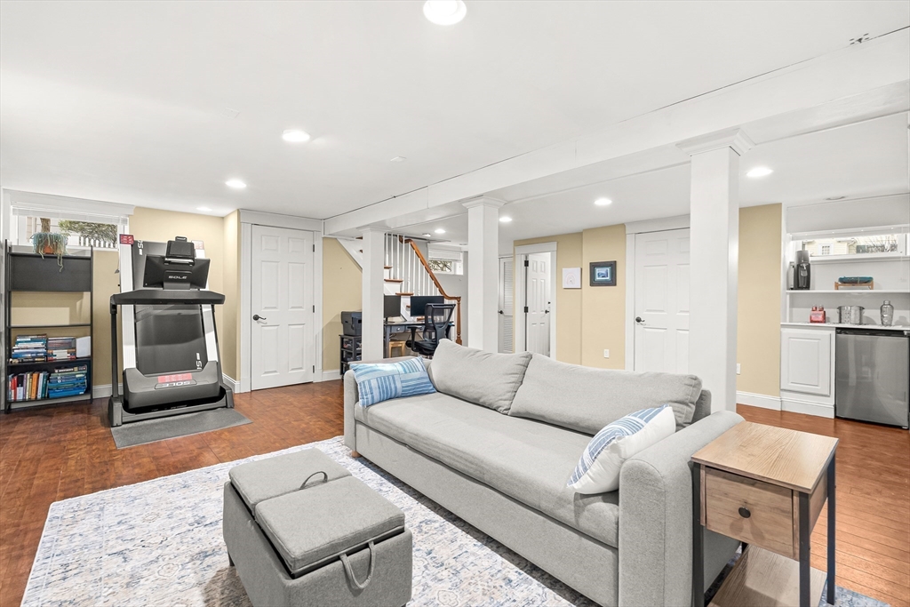 89 Lovell Road Melrose, MA 02176 - Photo 30 of 38 a living room with furniture and a kitchen view