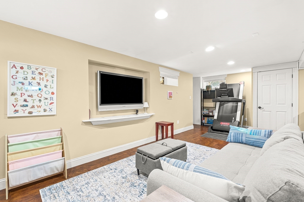 89 Lovell Road Melrose, MA 02176 - Photo 31 of 38 a living room with furniture and a flat screen tv