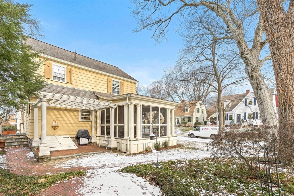 89 Lovell Road Melrose, MA 02176 - Photo 35 of 38 a front view of a building with a tree