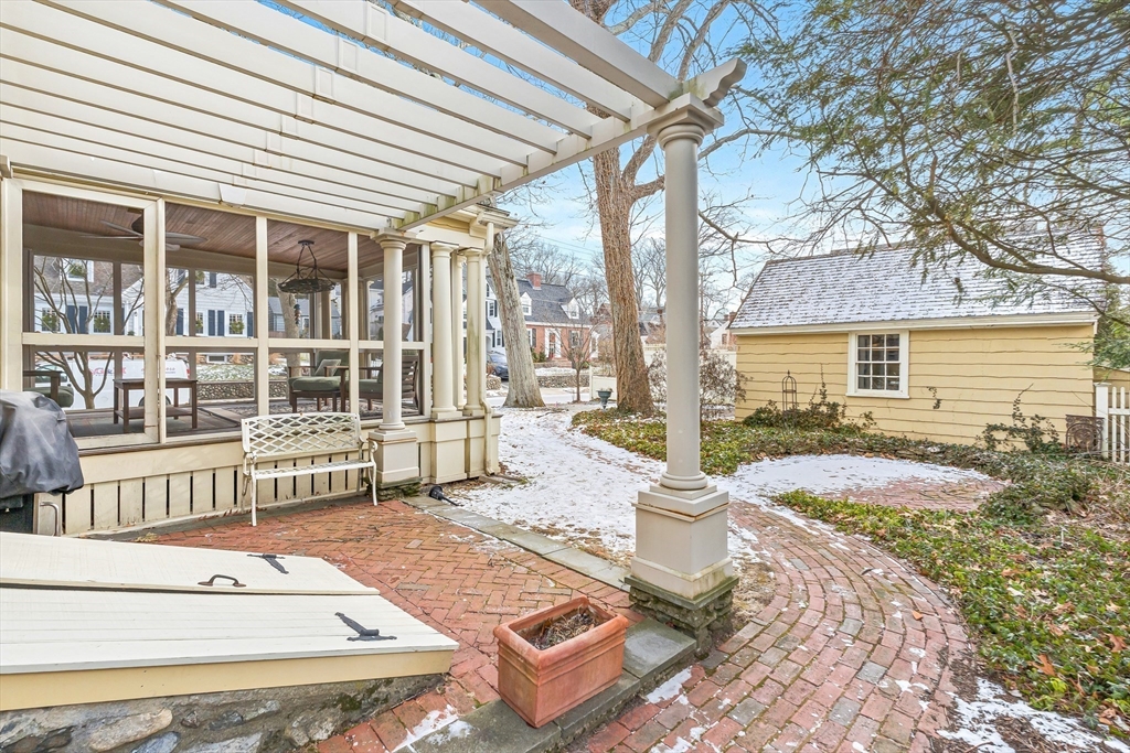89 Lovell Road Melrose, MA 02176 - Photo 36 of 38 a view of a patio with table and chairs and wooden fence