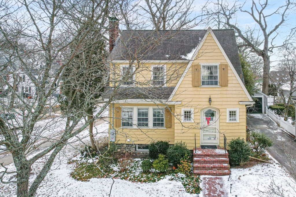 89 Lovell Road Melrose, MA 02176 - Photo 4 of 38 a view of a white house with a large tree
