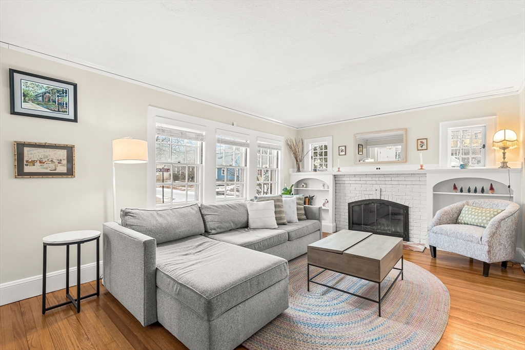 89 Lovell Road Melrose, MA 02176 - Photo 8 of 38 a living room with furniture and a fireplace