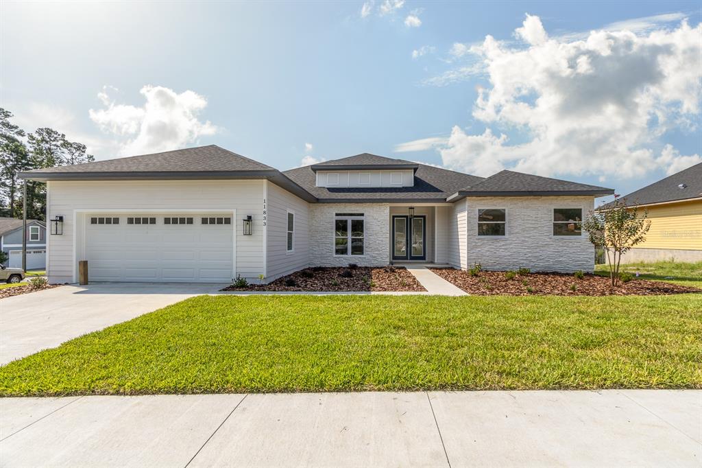 11833 Northwest 15th Road Gainesville, FL 32606 - Photo 1 of 1 a view of a house with back yard