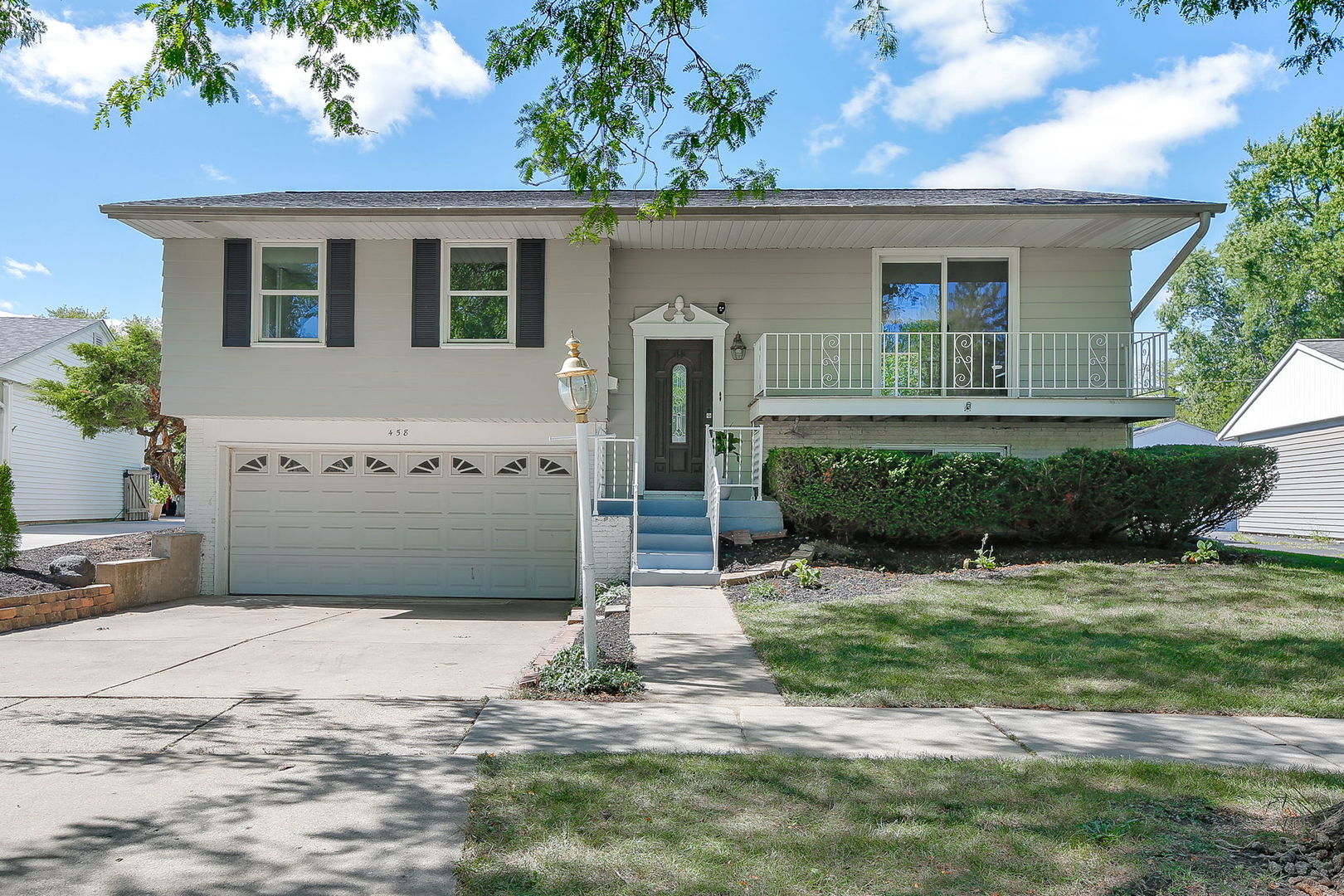 458 White Pine Road Buffalo Grove, IL 60089 - Photo 1 of 25 a front view of a house with a yard