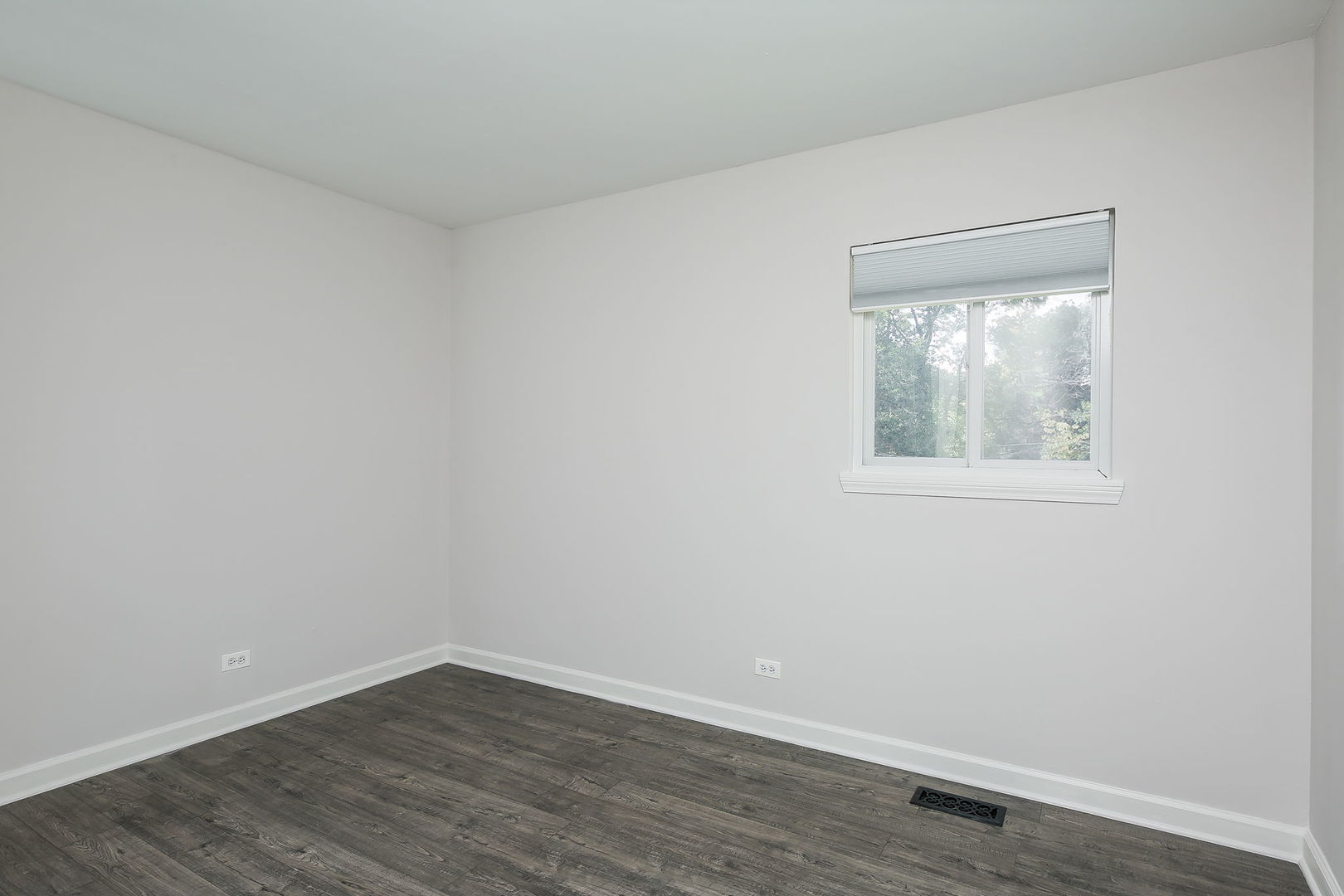458 White Pine Road Buffalo Grove, IL 60089 - Photo 12 of 25 a view of an empty room with wooden floor and a window