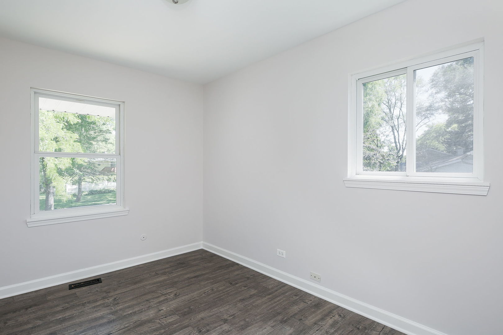 458 White Pine Road Buffalo Grove, IL 60089 - Photo 14 of 25 a view of an empty room with wooden floor and a window