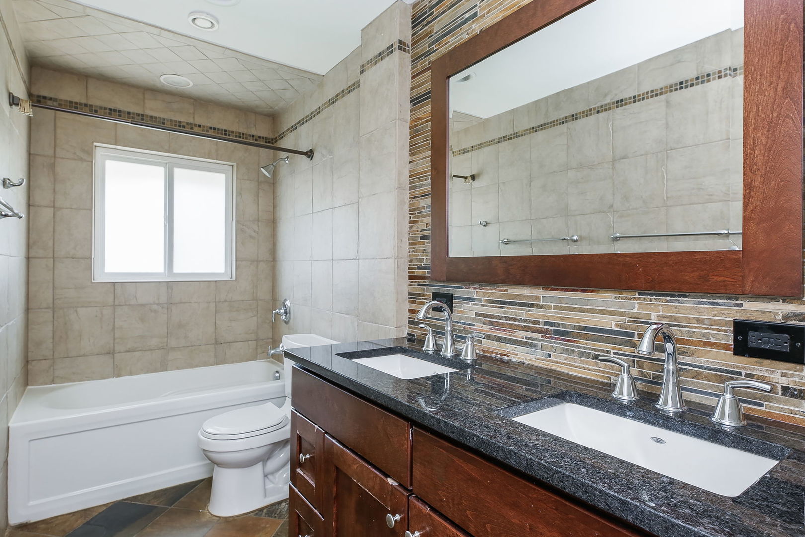 458 White Pine Road Buffalo Grove, IL 60089 - Photo 15 of 25 a bathroom with a granite countertop sink a toilet a mirror and bathtub